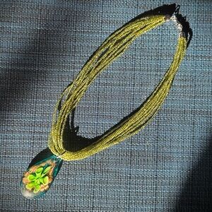 Green Beaded Necklace with Floral Pendant